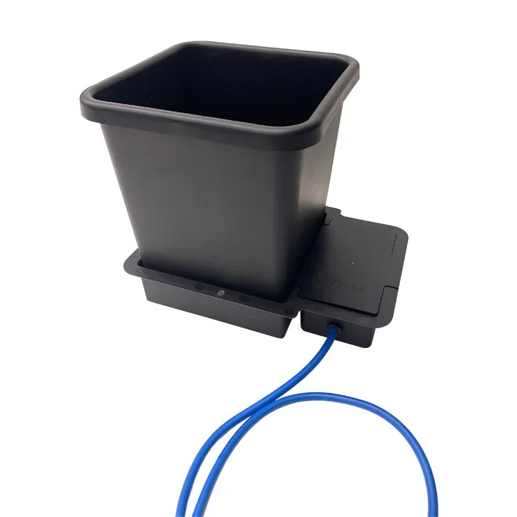 Black plastic AutoPot 1Pot system planter with water reservoir and blue irrigation tube