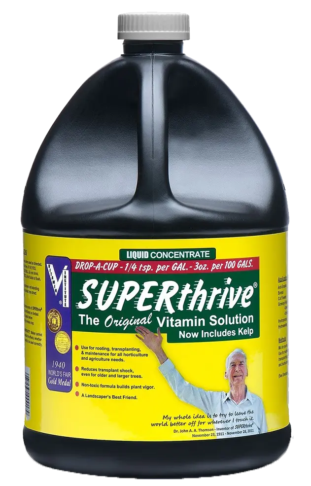 One gallon bottle of SUPERthrive liquid concentrate plant vitamin solution with yellow and green label